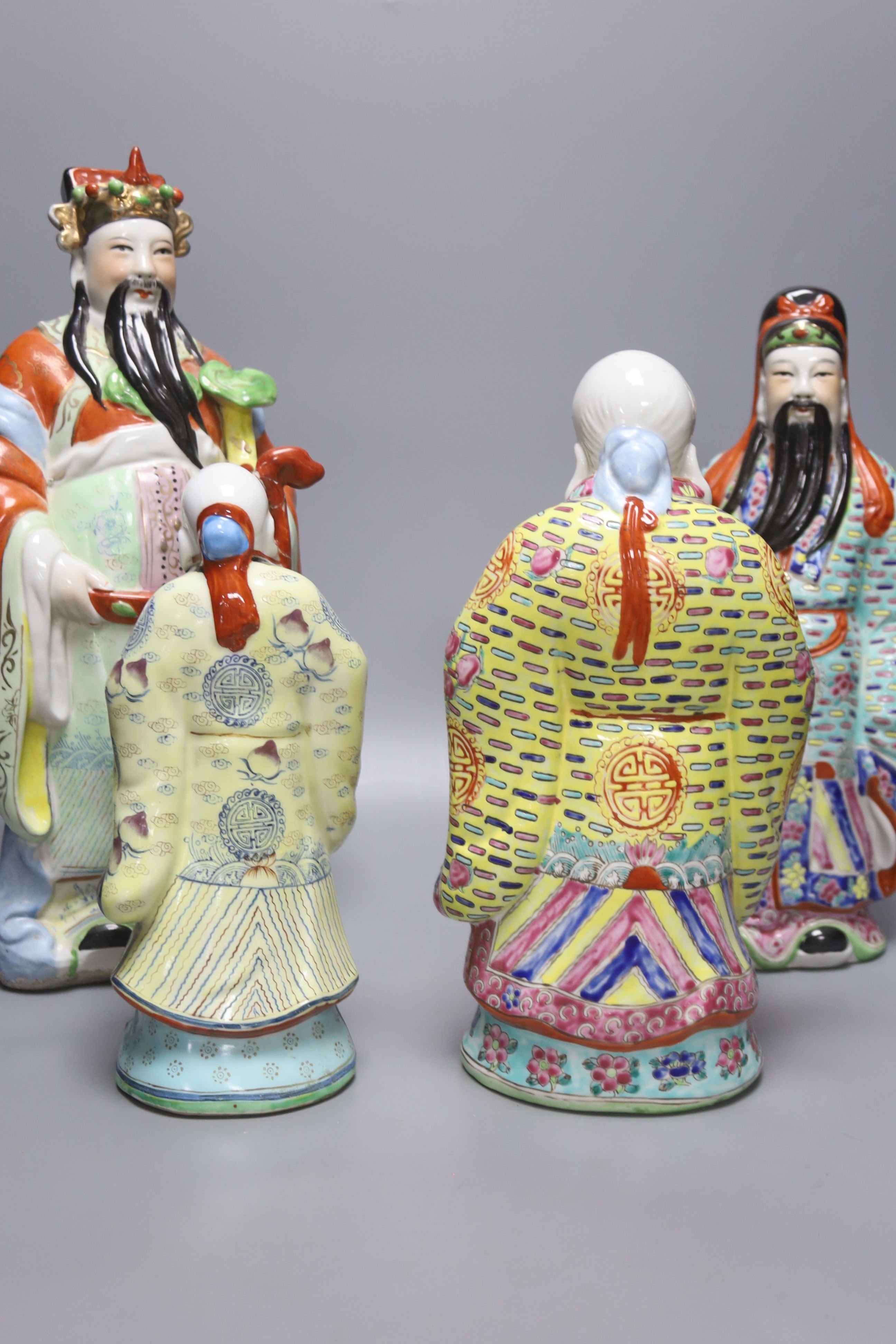 Four 20th century earthenware Chinese figures, tallest 39cm